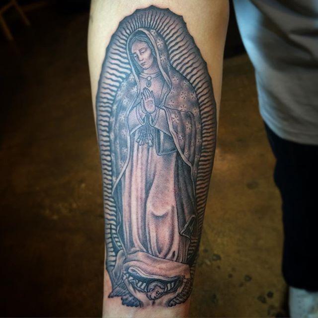 tatuaje motivo religioso 311